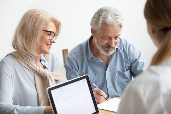 An adviser discussing equity release with clients. 